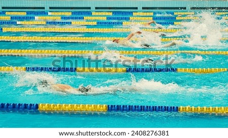 Turquoise swimming pool lanes, a symbol of sport. Royalty-Free Stock Photo #2408276381