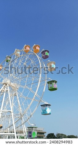 Ferris wheel in Krakatau Park Royalty-Free Stock Photo #2408294983