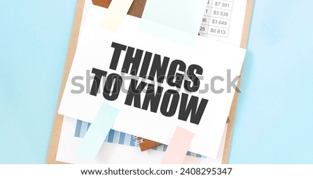 Paper plate with text take THINGS TO KNOW. Diagram, notepad and blue background