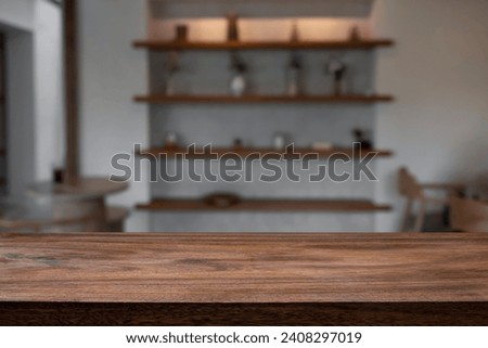 Empty wooden table with blurry background of bar and bistro cafe.