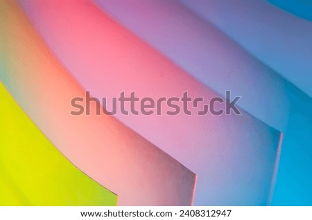 Abstract colorful macro background, made with white paper sheets and colorful lights.Abstract colorful macro background, made with white paper sheets and colorful lights.