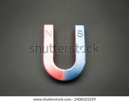 U-shaped magnetic bar on a dark background