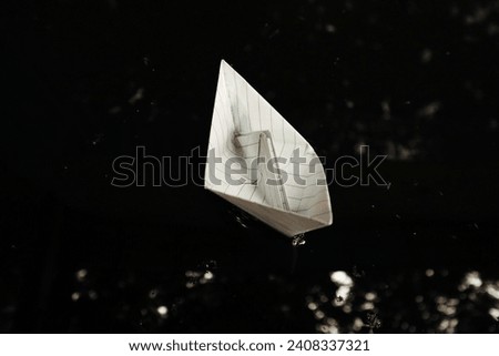 white paper boat seen above