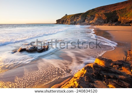 Beautiful sunset on Porthcew beach at Rinsey Cove Cornwall England UK Europe
