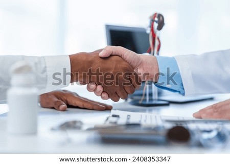close-up handshake between two individuals, doctor and other casual shirt. doctor-patient relationship, agreement on treatment plan,  conclusion of medical consultation. Royalty-Free Stock Photo #2408353347