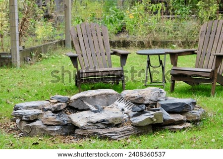 An outdoor seating area with a rustic fire pit.