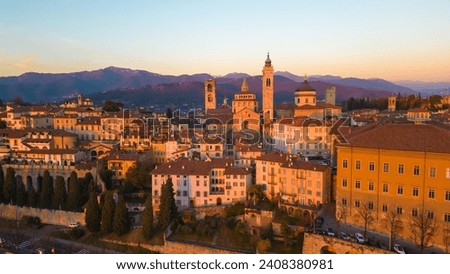 Citta Alta - Bergamo, Italy. Drone aerial view of the old town during sunrise. Landscape at the city center, its historical buildings. High quality photo