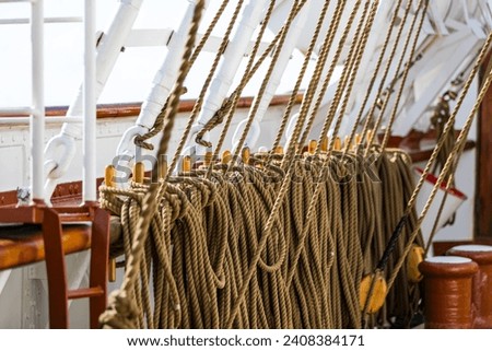 A series of ropes that control sails in a tall ship.  This picture was taken in the Caribbean sea.