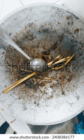 A used cooking pan, stained and soiled after cooking. Royalty-Free Stock Photo #2408386177