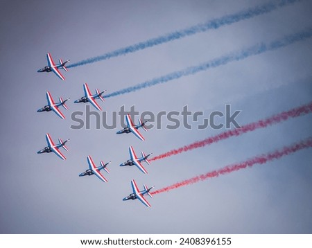 Patrouille de France air show in Cazaux. Alphajet from French air force. Royalty-Free Stock Photo #2408396155