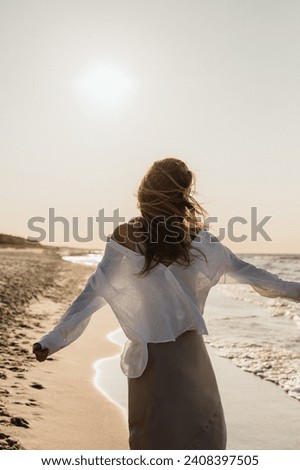 Girl standing on the beach during the day