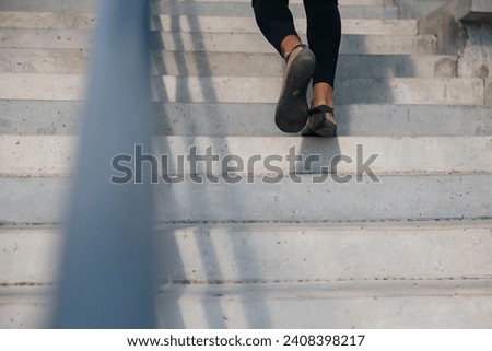 Close up picture of mans legs on the stairs