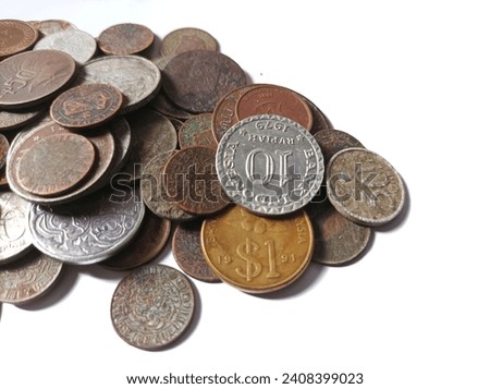 Various kinds of currency coins from various countries that are no longer used isolated on a white background. concept of collecting old money or metal coins
