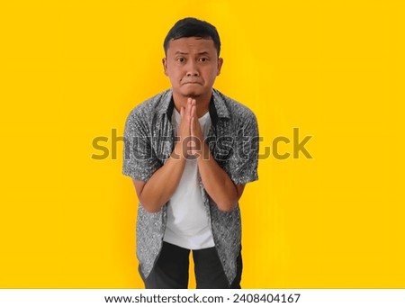 Funny face of asian man beg for forgiveness of his mistake, Gesture of asian man sorry and apologizing, Crying Asian man asking for forgiveness , Indonesian man whining asking for forgiveness. Royalty-Free Stock Photo #2408404167