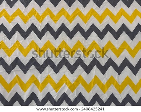 Photo illustrating gold and silver Chevron zigzag stripe pattern