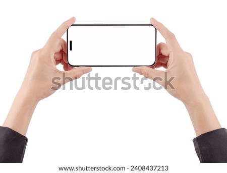 Woman's hand holding a phone is using her hand to touch the screen on a white background.
