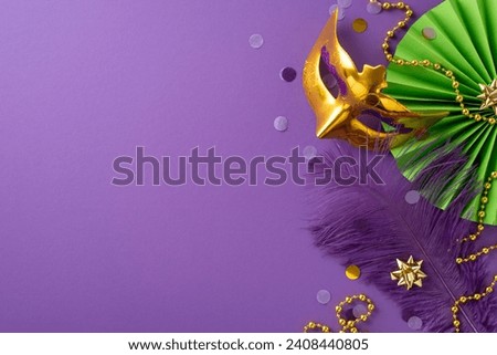 Extravagant Euphoria: Revel in grandeur of top view shot featuring lavish Venice mask, ornamental beads, feather, confetti, vivid paper fan set against purple backdrop, with space for your text