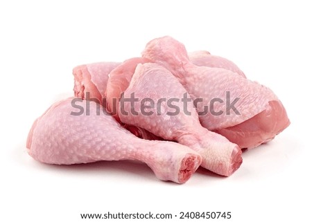 Raw chicken drumsticks, isolated on white background Royalty-Free Stock Photo #2408450745