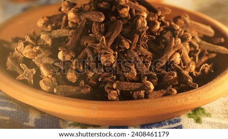 Tasty spice: Culinary magic of dried Cloves in delectable delights. Close up view of cloves on table.