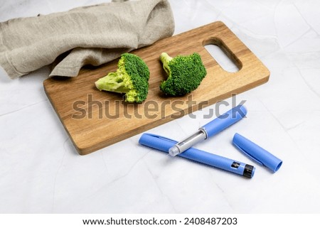 Ozempic Insulin injection pen or insulin cartridge pen for diabetics. Medical equipment for diabetes parients.    Royalty-Free Stock Photo #2408487203