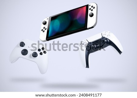Next Generation game controllers on white background  Royalty-Free Stock Photo #2408491177