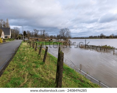 High water in Holland, flooded river IJssel Royalty-Free Stock Photo #2408496285