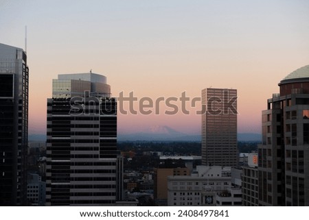 Portland (OR) skyline at dusk in fall, autumn with Mt St Helens