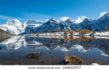The Reflection in Minestima Lake, Larch Season in The Larch Valley, Fell in the Valley of Ten Peaks, Banff National Park, Canada Royalty-Free Stock Photo #2408503957