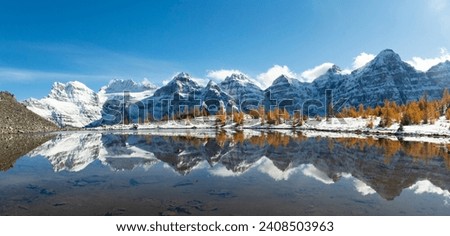 The Reflection in Minestima Lake, Larch Season in The Larch Valley, Fell in the Valley of Ten Peaks, Banff National Park, Canada Royalty-Free Stock Photo #2408503963