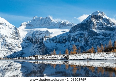 The Reflection in Minestima Lake, Larch Season in The Larch Valley, Fell in the Valley of Ten Peaks, Banff National Park, Canada Royalty-Free Stock Photo #2408503969