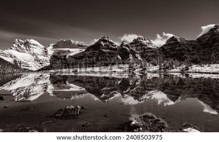 The Reflection in Minestima Lake, Larch Season in The Larch Valley, Fell in the Valley of Ten Peaks, Banff National Park, Canada Royalty-Free Stock Photo #2408503975