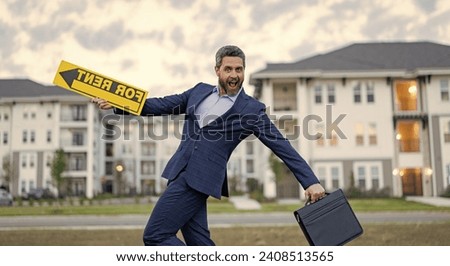 surprised renter adviser man hold board for rent sign. rent house with renter adviser man