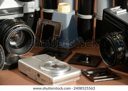 Old mechanical cameras, boxes of films, slides. Retro