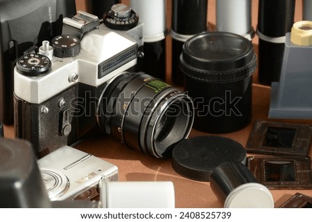 A set of old cameras, lenses, films, slides. Retro