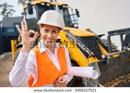 Site manager expressing her approval of construction works during inspection