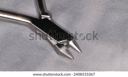 Bird beak plier, an orthodontic instrument Royalty-Free Stock Photo #2408531067