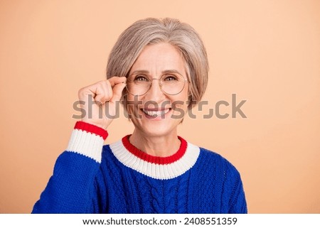 Portrait of cheerful positive lady teacher wear trendy clothes eyeglasses isolated on beige color background