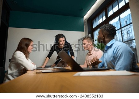 Bossy woman demanding creative ideas for new project from multiethnic team Royalty-Free Stock Photo #2408552183