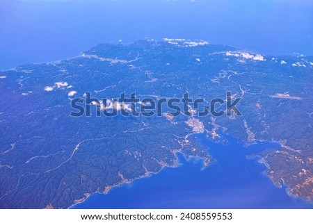 Anamizu town and Noto Airport seen from above the Noto Peninsula in Ishikawa Prefecture Royalty-Free Stock Photo #2408559553
