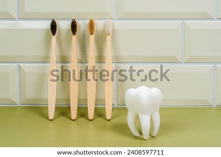 Tooth and eco tooth brushes on a beige background. Concept of dental examination of teeth, health and dental hygiene. Prevention of caries and tartar teeth. Bathroom. Morning routine