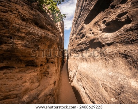 Close up of small narrow passage between stones in canyonlands national park in Utah, America, usa Royalty-Free Stock Photo #2408629223