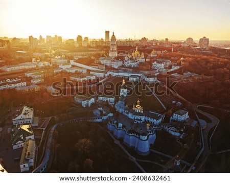 Panoramic view from the drone to the Kiev Pechersk Lavra with numerous architectural monuments at sunset in the summer. Panoramic photography from the drone.