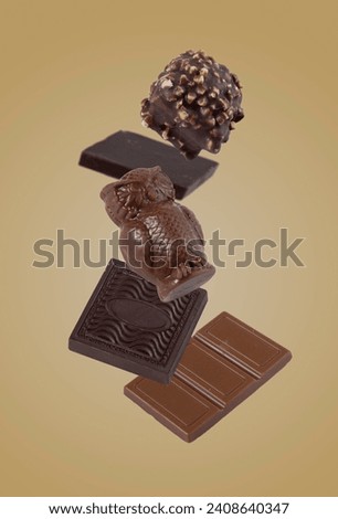 chocolate candies flying on a yellow background