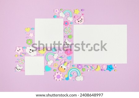 Three blank white cards on pastel purple background with frame of cute kawaii air plasticine handmade cartoon animals, rainbows. Empty photo frames, baby's photo book, scrapbooking design template