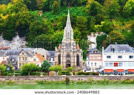 The coast of the Seine River in France in the suburbs of Rouen with beautiful private houses and dense green vegetation. Royalty-Free Stock Photo #2408649883