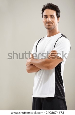 Arms crossed, portrait or athlete in studio for fitness workout, sports exercise or healthy wellness. Mockup space, grey background or man ready to start training with confidence, discipline or pride Royalty-Free Stock Photo #2408674673