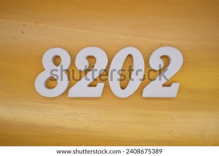 The golden yellow painted wood panel for the background, number 8202, is made from white painted wood.