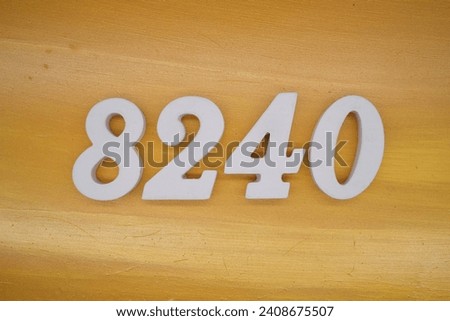 The golden yellow painted wood panel for the background, number 8240, is made from white painted wood.