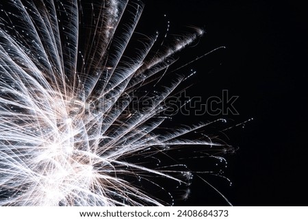 picture with fireworks to welcome the new year, light flowers in the sky, holiday celebration, light painting