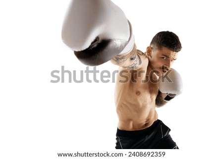 Hook. Muscular, shirtless young man, boxer training, fighting isolated over white background. Concept of professional sport, combat sport, martial arts, strength Royalty-Free Stock Photo #2408692359